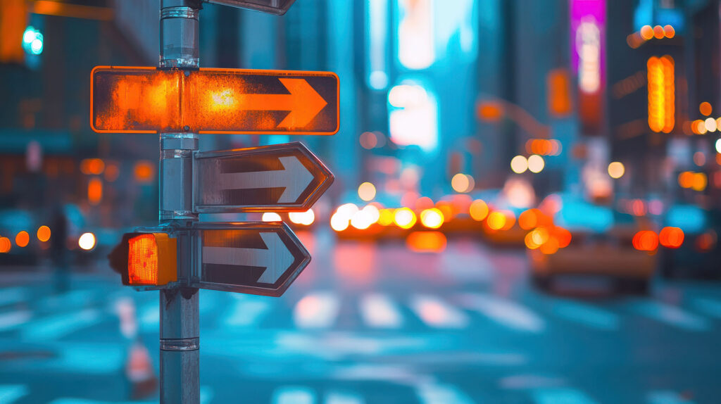 a busy city street with signs pointing in various directions