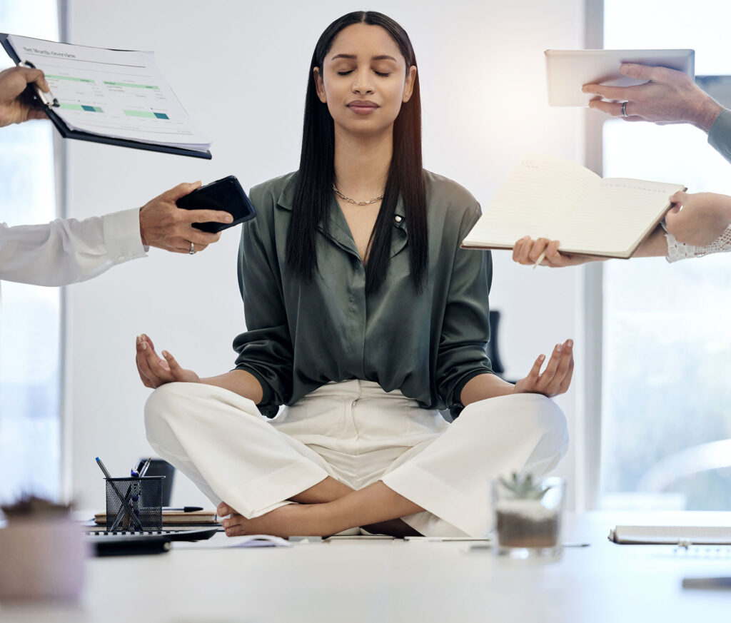 a photo of a woman peacefully meditating while others around her try to distract her with urgency