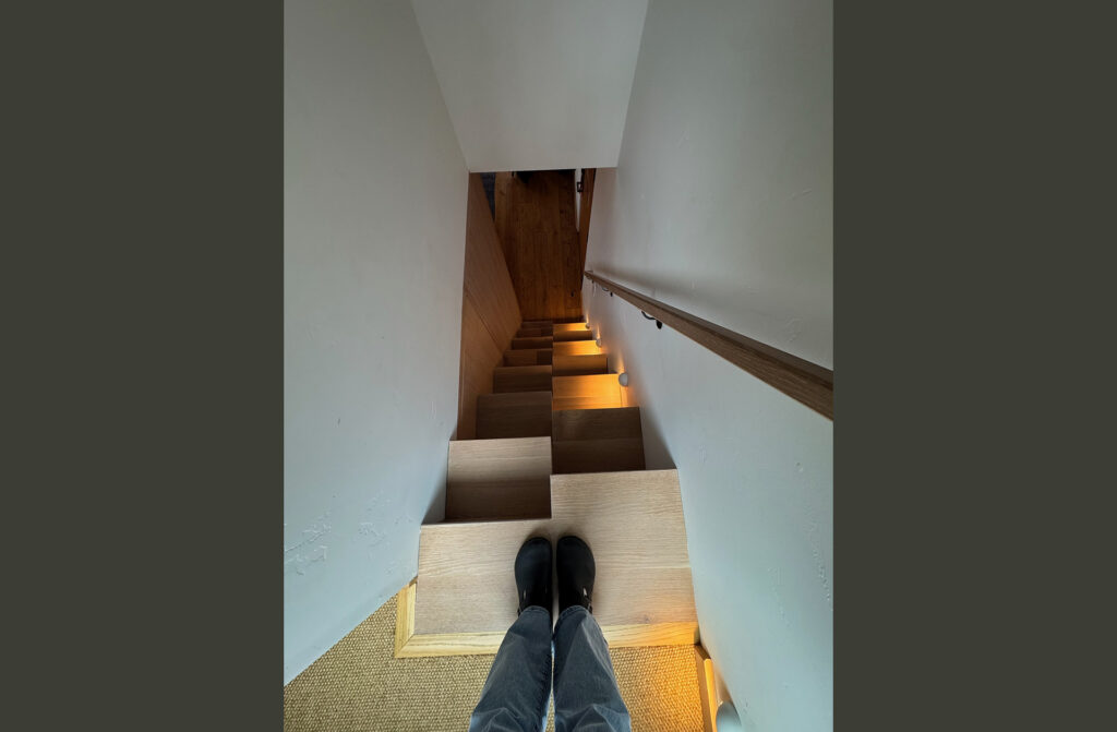 a point-of-view photo looking down from the top of a staircase